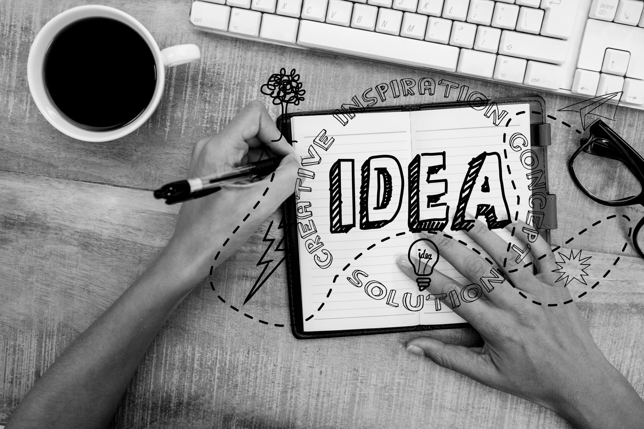 digital composite of hands using notebook with graphics